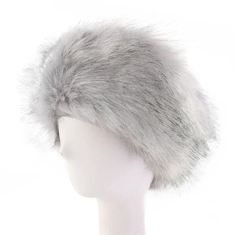 Light gray faux fur hat displayed on white mannequin head, fluffy texture winter fashion accessory