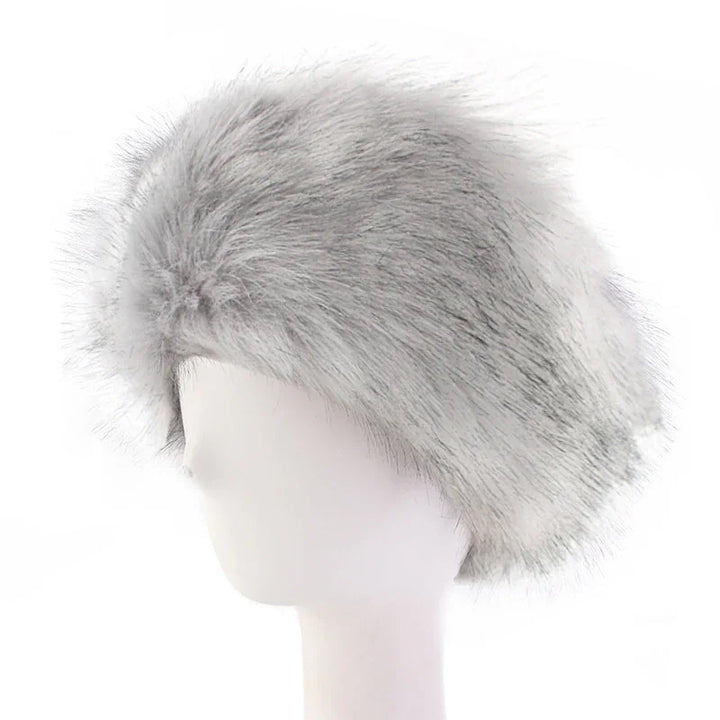 Light gray faux fur hat displayed on white mannequin head, fluffy texture winter fashion accessory