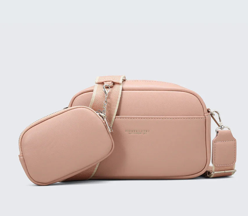 Minimalist blush pink crossbody bag with adjustable strap and detachable small pouch