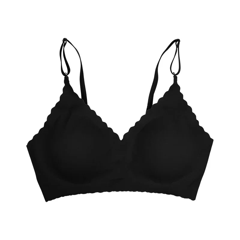 Black scalloped-edge wireless bra with adjustable straps on white background