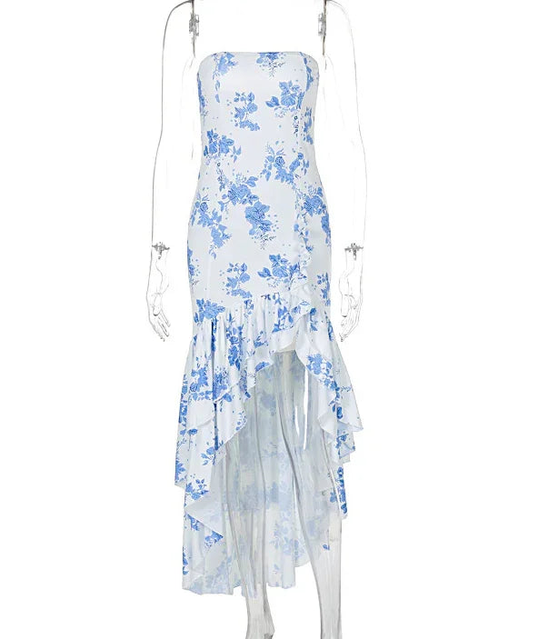 white midi dress with blue floral print and ruffled asymmetrical hem on clear mannequin