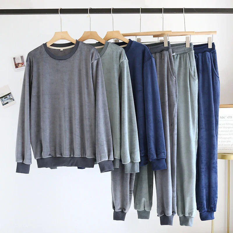 Soft suede fabric long sleeve tops and matching jogger pants in gray, green, and navy blue on wooden hangers