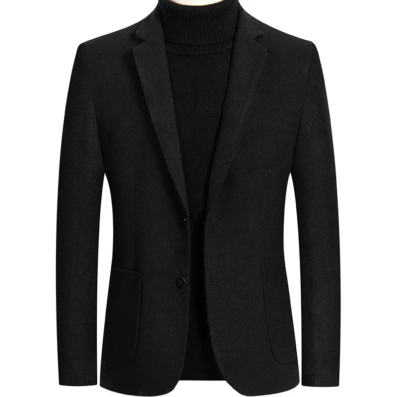 Black men's blazer with notch lapels and front pockets over a black turtleneck sweater