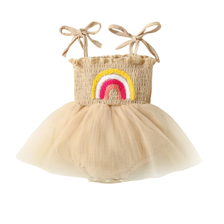 Beige baby dress with tulle skirt and colorful embroidered rainbow on smocked bodice with shoulder ties