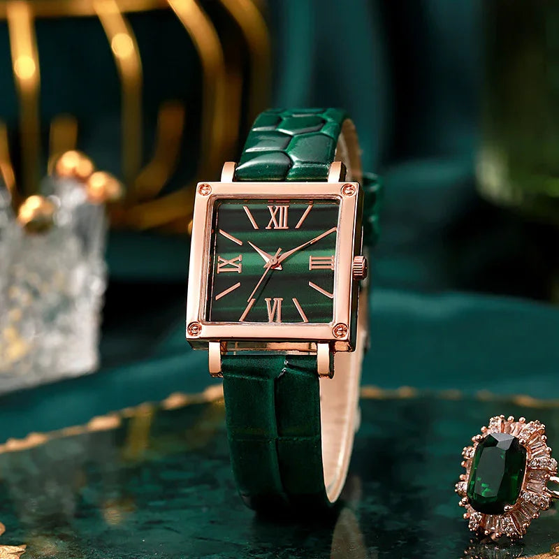 Elegant square gold watch with green leather strap and Roman numerals on dark green dial