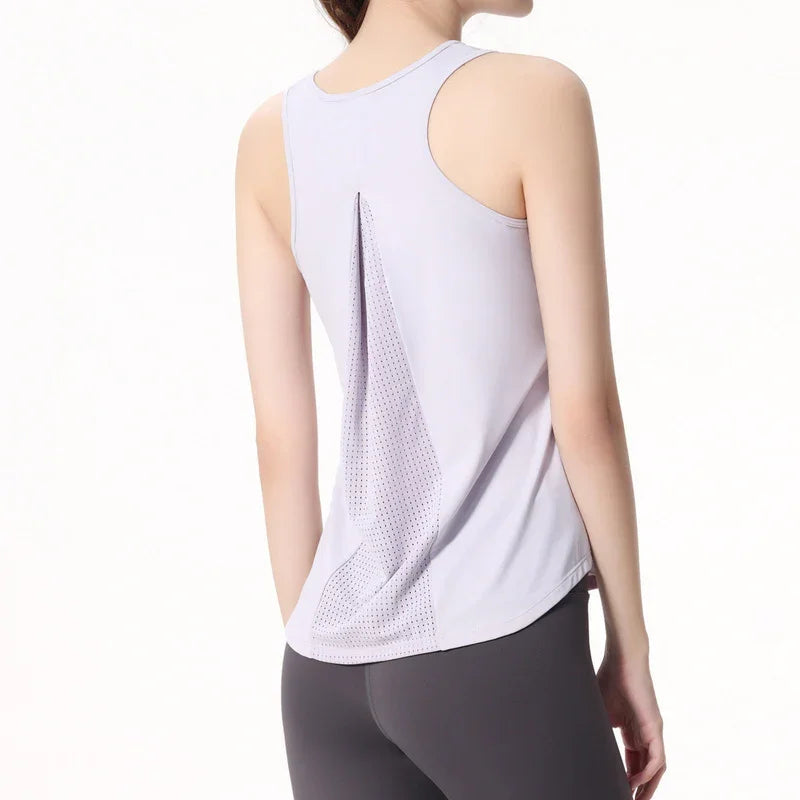 Woman wearing a light purple racerback workout tank top with mesh back panel