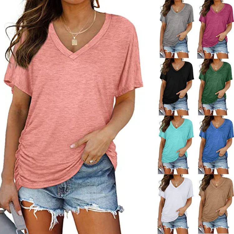 Woman wearing casual v-neck t-shirt in coral paired with ripped denim shorts, showing eight color options