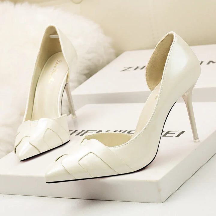 Elegant white leather high heel pumps with pointed toe and woven detail on white box