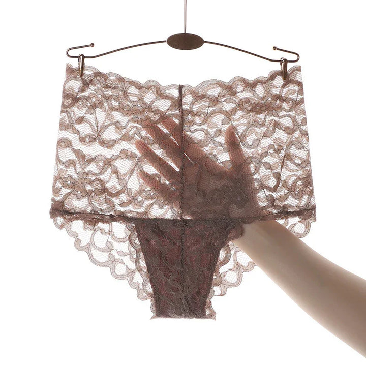 Sheer brown lace women's underwear held on a hanger with hand behind fabric showing transparency