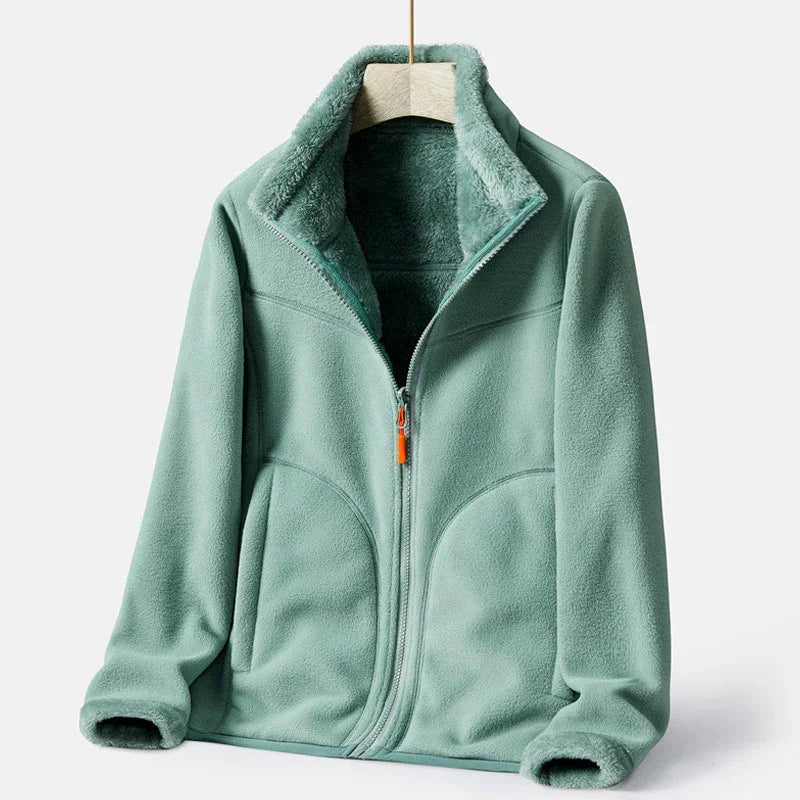 light green full-zip fleece jacket with plush lining and high collar on wooden hanger