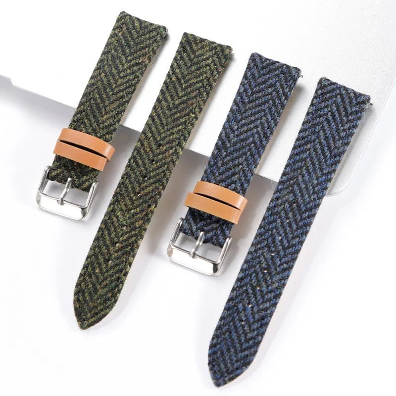 Green and blue herringbone fabric watch straps with tan leather loops and silver buckles on white background