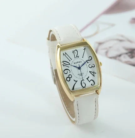 Elegant white leather strap watch with gold rectangular case and black stylized numbers