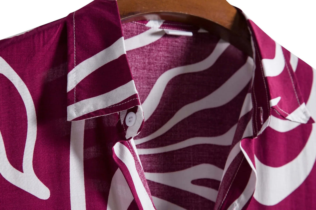 Close-up of maroon and white abstract patterned cotton shirt collar on wooden hanger