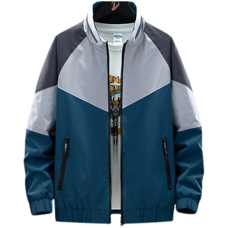 Men's color-block windbreaker jacket with blue, gray, and dark gray panels, front zipper and pockets