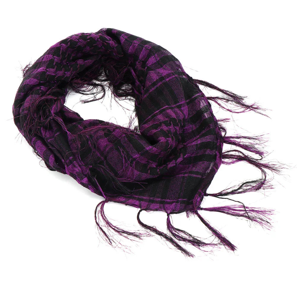 Purple and black checkered scarf with fringed edges on white background