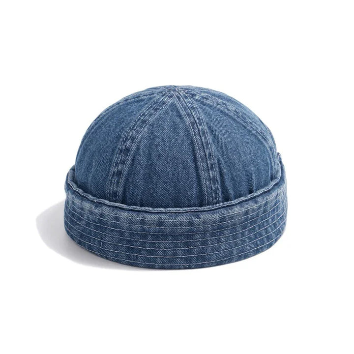 Denim blue roll-up brim beanie hat on white background