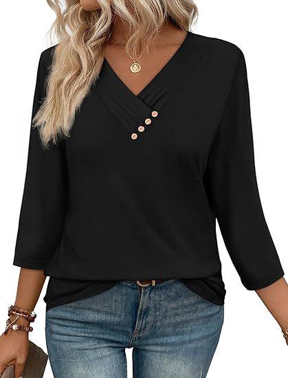 Woman wearing black V-neck blouse with 3-button detail and 3/4 sleeves, paired with blue jeans