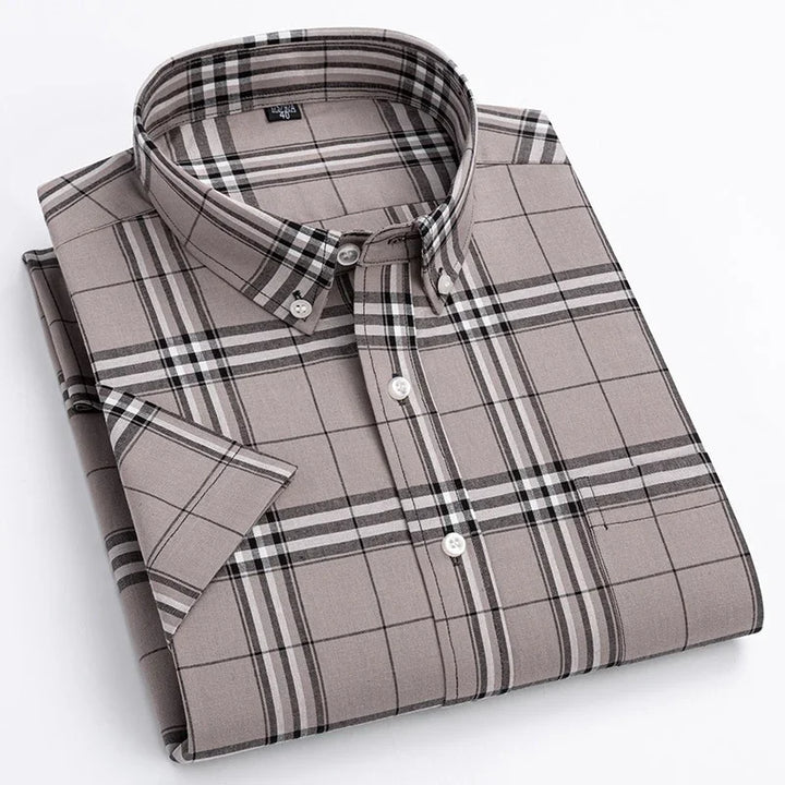 Folded short sleeve men's button-down shirt with beige and black plaid pattern