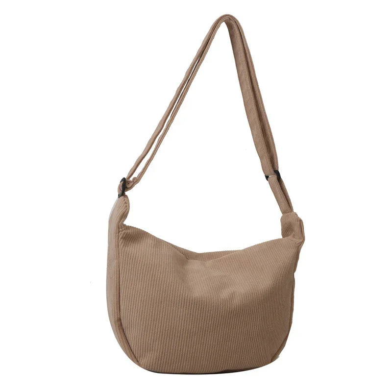 Beige corduroy shoulder bag with adjustable strap and soft hobo design