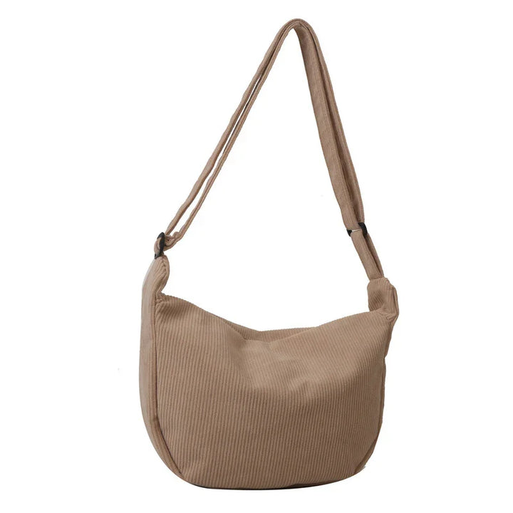 Beige corduroy shoulder bag with adjustable strap and soft hobo design
