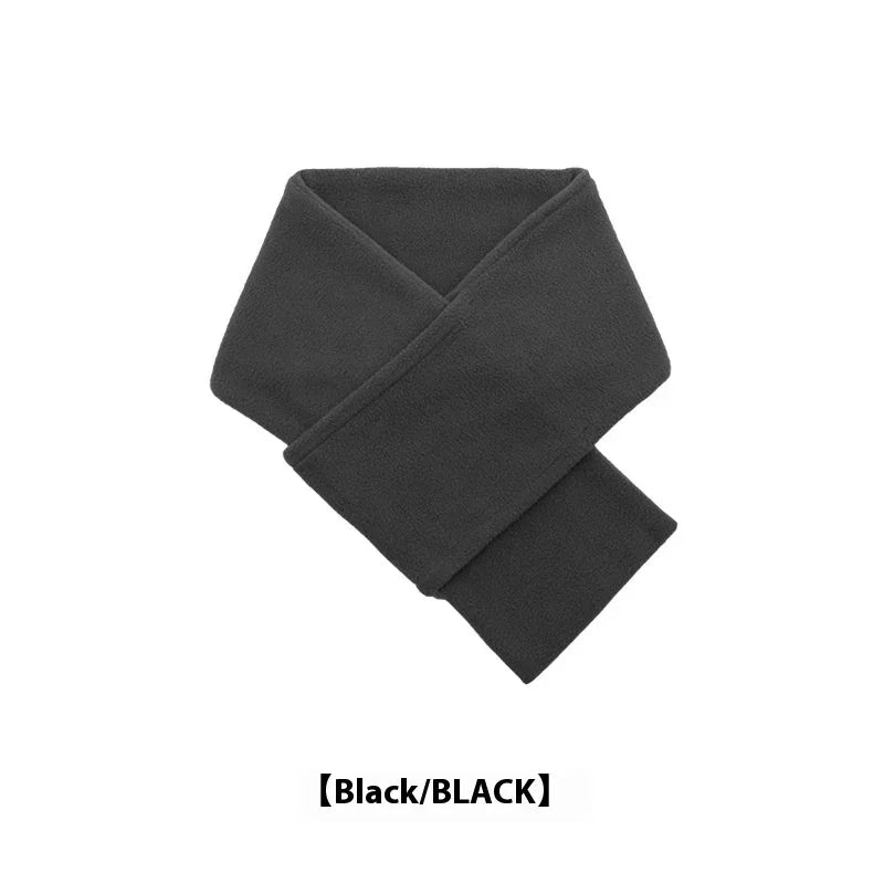 Black fleece scarf folded on white background, cozy winter accessory