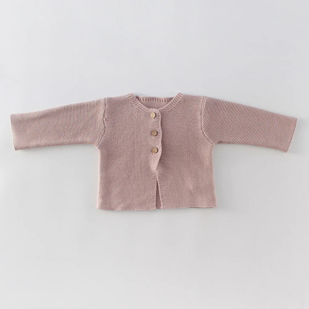 Light brown knitted baby cardigan with three buttons on front, long sleeves, laid flat