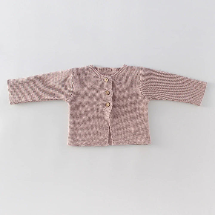 Light brown knitted baby cardigan with three buttons on front, long sleeves, laid flat