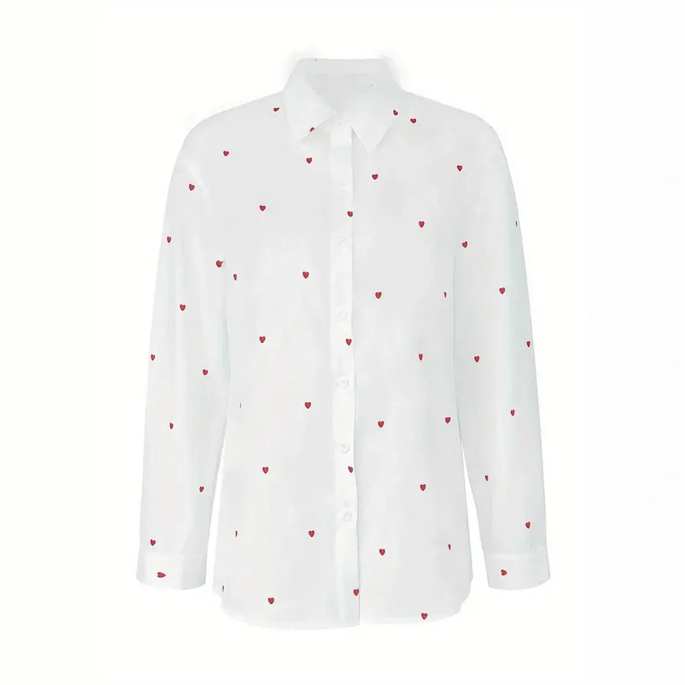 White long-sleeve button-up shirt with small red heart print pattern