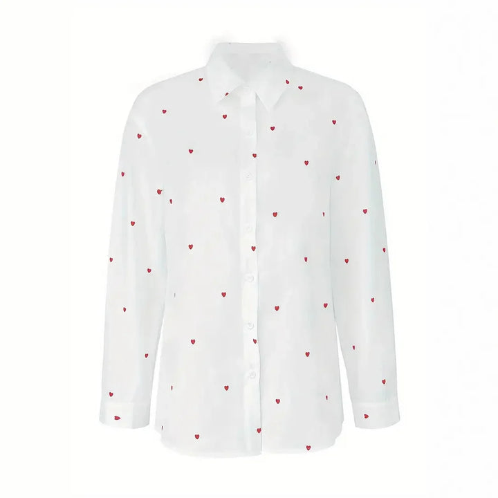 White long-sleeve button-up shirt with small red heart print pattern