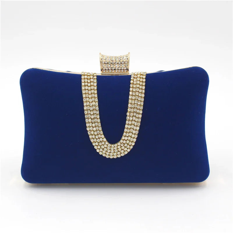 Royal blue velvet clutch purse with gold and rhinestone chain and clasp detail