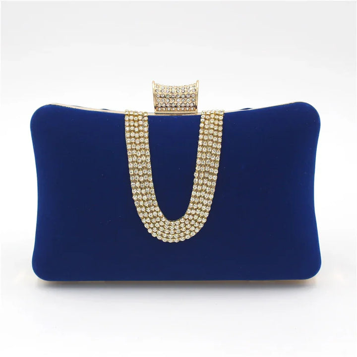 Royal blue velvet clutch purse with gold and rhinestone chain and clasp detail