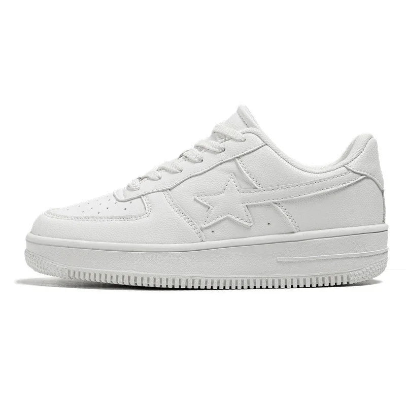 All-white low-top sneaker with star design on side and textured sole