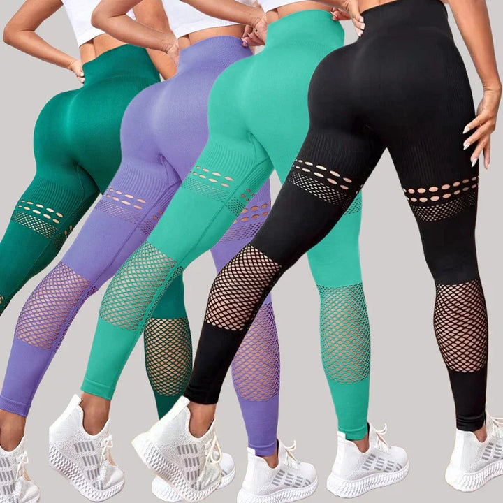 Four women wearing high-waisted seamless leggings in green, purple, teal, and black with mesh cutouts, paired with white sneakers