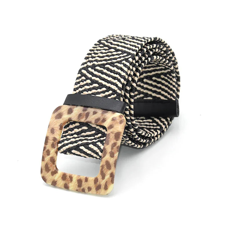 Black and white woven belt with leopard print square buckle on white background