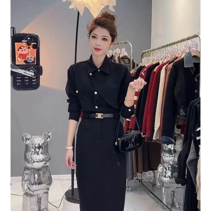 Woman in black dress with gold buttons and belt posing in stylish clothing store with racks and disco bear statues