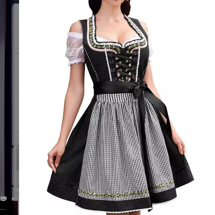 Black and white traditional Bavarian dirndl dress with lace blouse and checkered apron