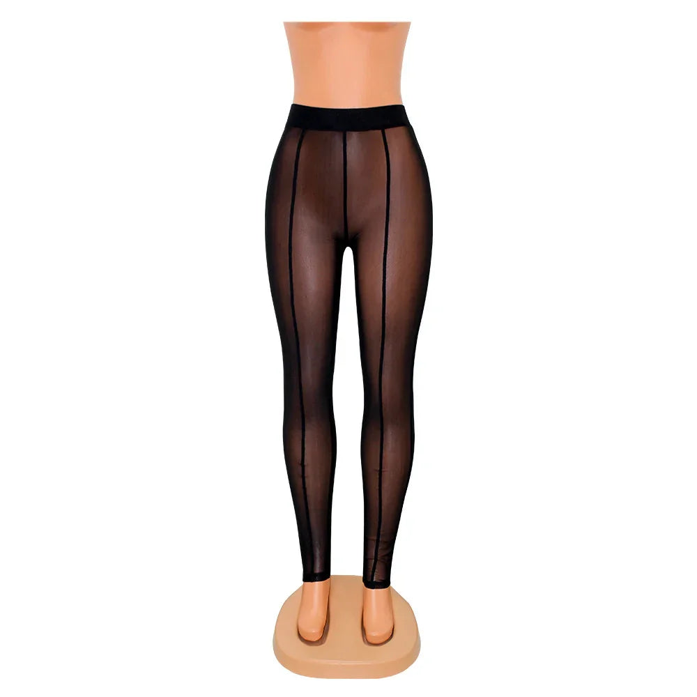 Black sheer leggings with vertical seam details on a mannequin against white background