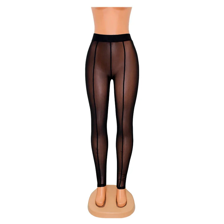 Black sheer leggings with vertical seam details on a mannequin against white background