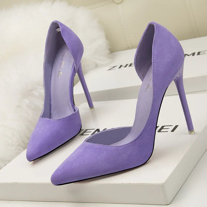 Elegant lavender purple suede high heel pumps with pointed toe on white shoe boxes