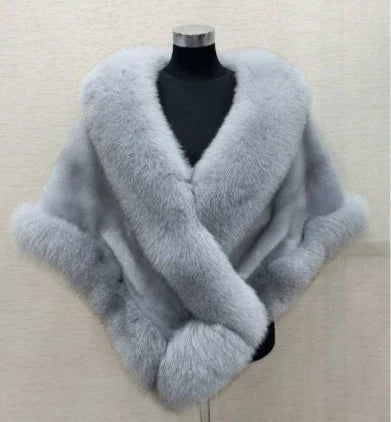 Luxurious light gray fur shawl with thick, soft texture displayed on black mannequin