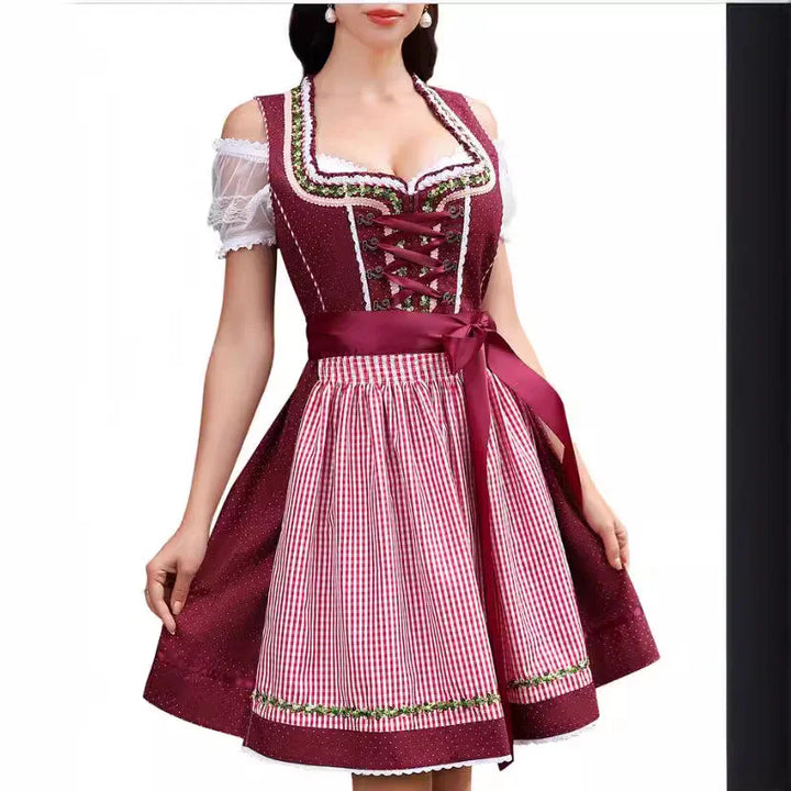 Burgundy traditional dirndl dress with white lace sleeves and red checkered apron