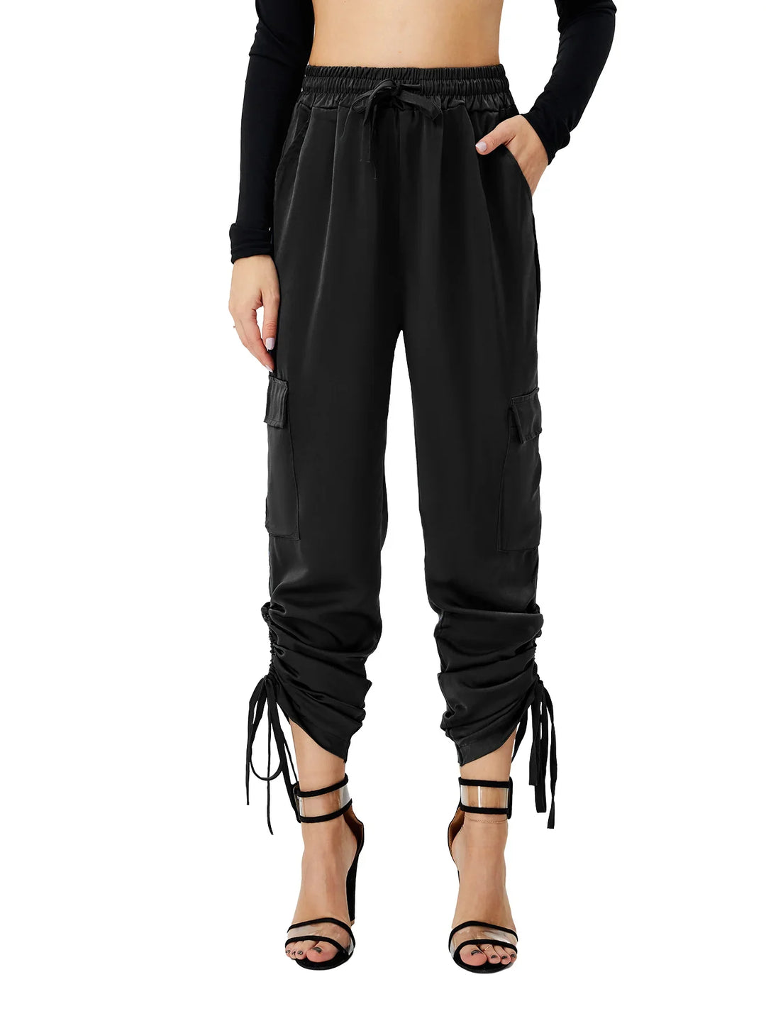 Woman wearing black ruched cargo pants with drawstring cuffs and black strappy high heels