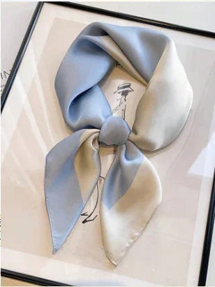 Light blue and cream silk scarf tied stylishly on a framed minimalist fashion sketch background