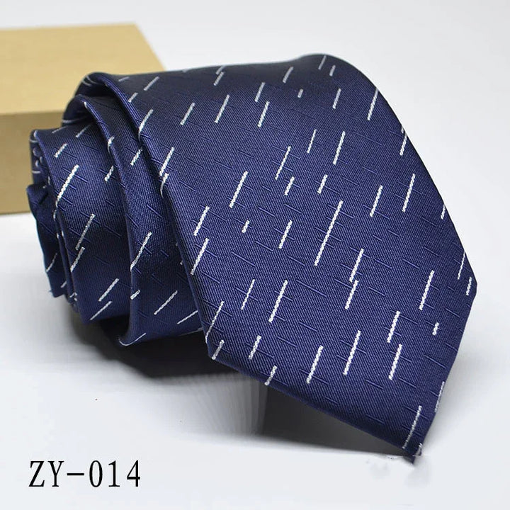Navy blue necktie with white diagonal dash pattern, folded on white surface, code ZY-014