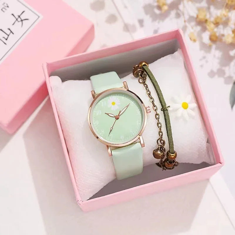 Mint green wristwatch with daisy design and matching bracelet in pink gift box