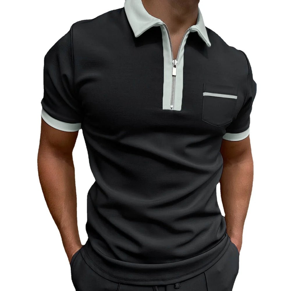 Men's black polo shirt with light grey collar, zipper, pocket trim, and sleeve edges