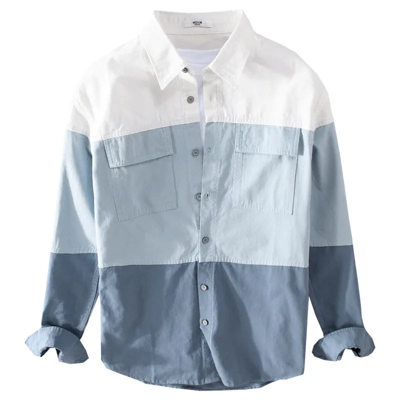Men's colorblock button-up shirt with white, light blue, and navy blue panels and chest pockets