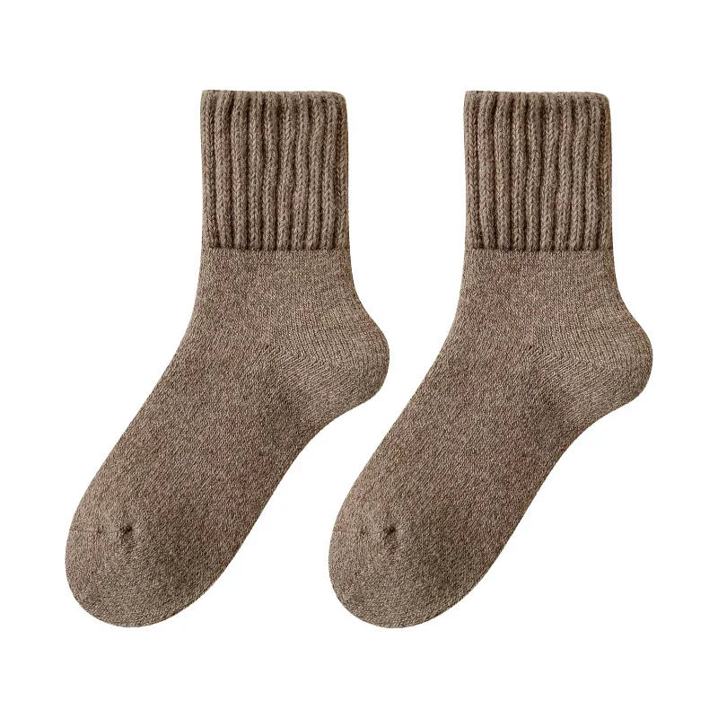 Pair of brown ribbed wool socks isolated on white background