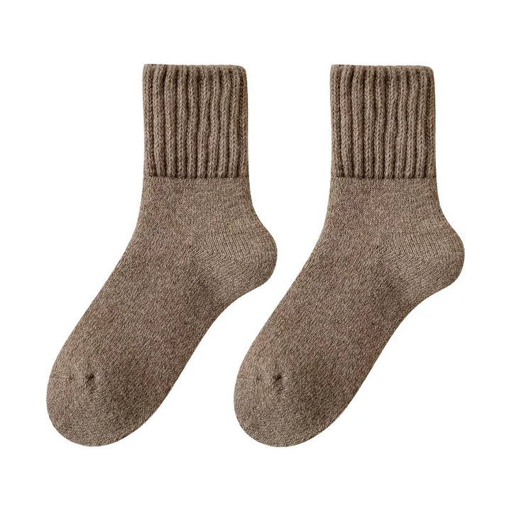 Pair of brown ribbed wool socks isolated on white background