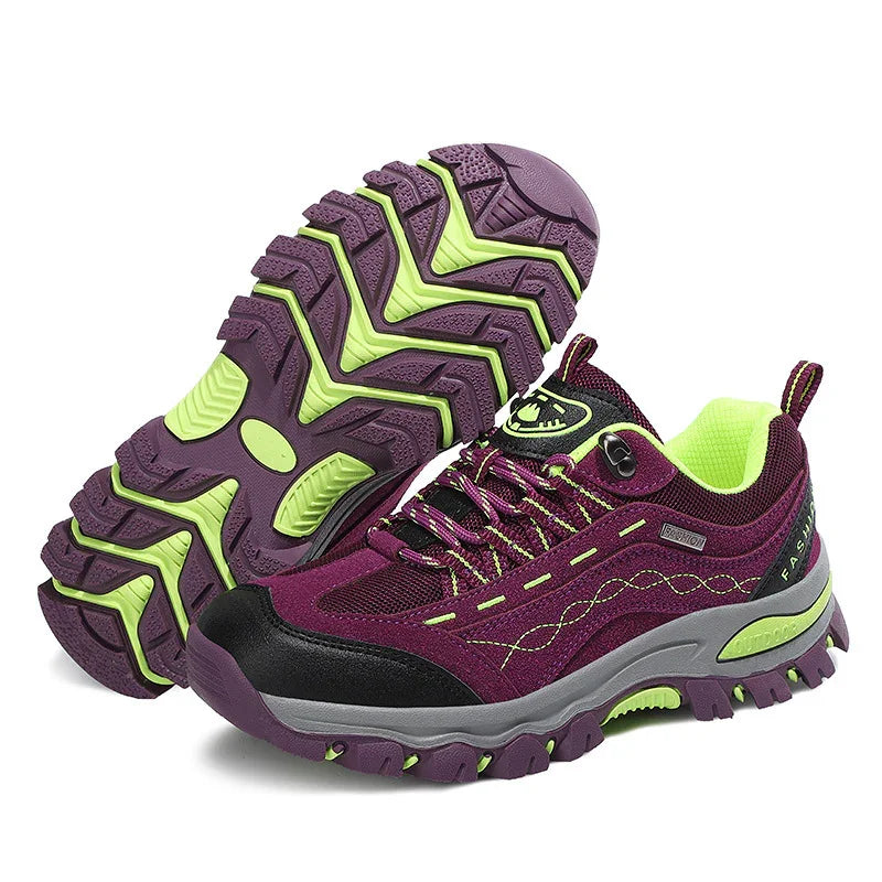 Purple and neon green hiking shoes with durable tread sole and breathable mesh design